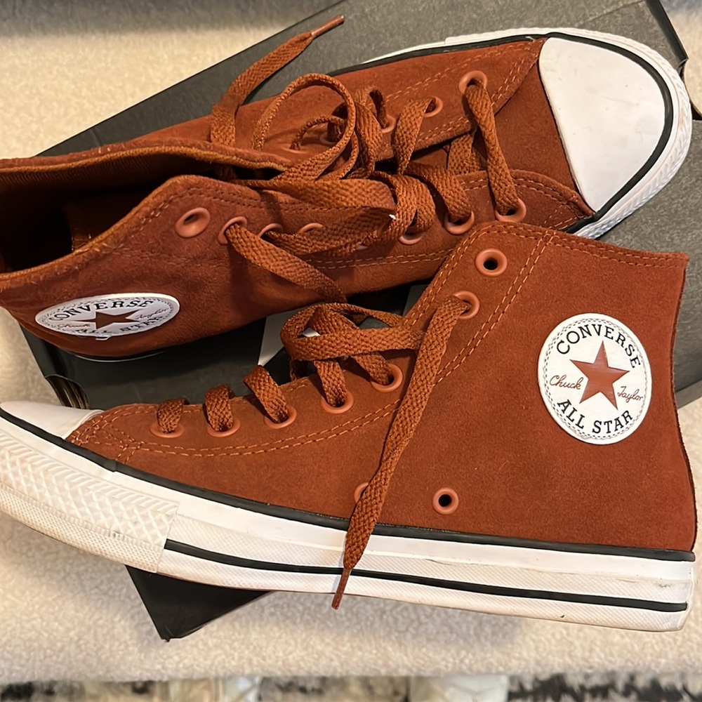 Brown converse high tops